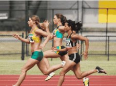 Rethinking Injury Prevention and Performance for Female Athletes Female track athletes sprinting on an outdoor track, showcasing strength, speed, and competition. The image highlights women’s athleticism in the context of research on performance, injury prevention, and equity in sports.
