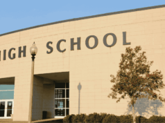 How Will School Choice Affect High School Athletics? A modern high school building. The image represents how open enrollment and school choice policies are reshaping high school athletics and competition.