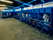 How To Spot Inequities in Your Sports Facilities Before They Become Complaints A clean, organized school locker room with rows of metal lockers and benches. The space is empty, highlighting the facilities student-athletes use and the importance of providing equal, well-maintained areas for all teams.