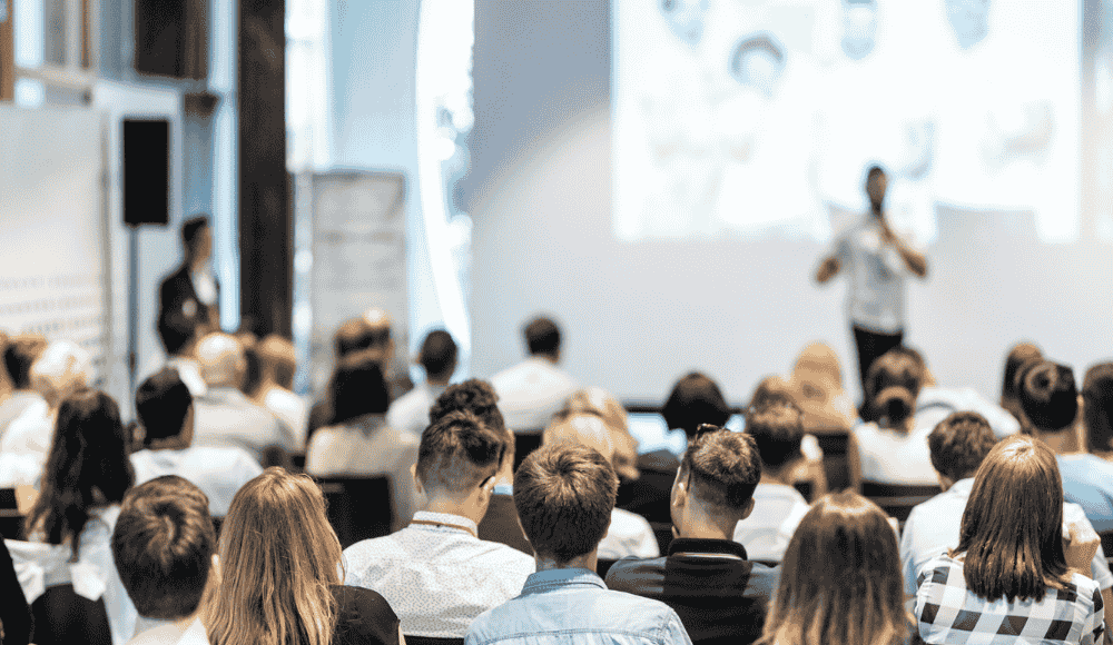 The Must-Attend 2026 Events Calendar for ADs Athletic directors and sports administrators attend a professional conference session, reflecting key 2026 athletics leadership events and must-attend conferences for ADs focused on governance, facilities, and student-athlete development.