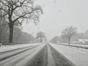 Postpone Or Play? A Ready-To-Use Cancellation Script That Keeps Everyone Aligned Snow-covered road during winter weather, illustrating athletic event cancellation decisions and safe travel considerations for schools and athletic departments