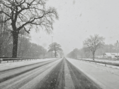 Postpone Or Play? A Ready-To-Use Cancellation Script That Keeps Everyone Aligned Snow-covered road during winter weather, illustrating athletic event cancellation decisions and safe travel considerations for schools and athletic departments